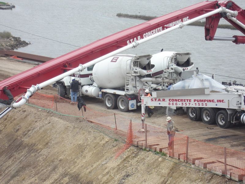 S.T.A.R. boom close up over a pit with mixers feeding the hopper